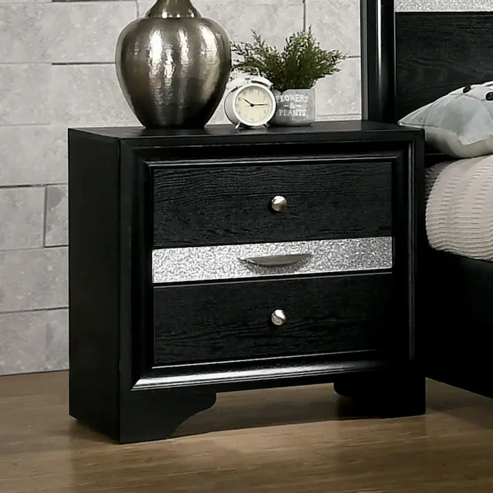 Black nightstand with decorative items on top.