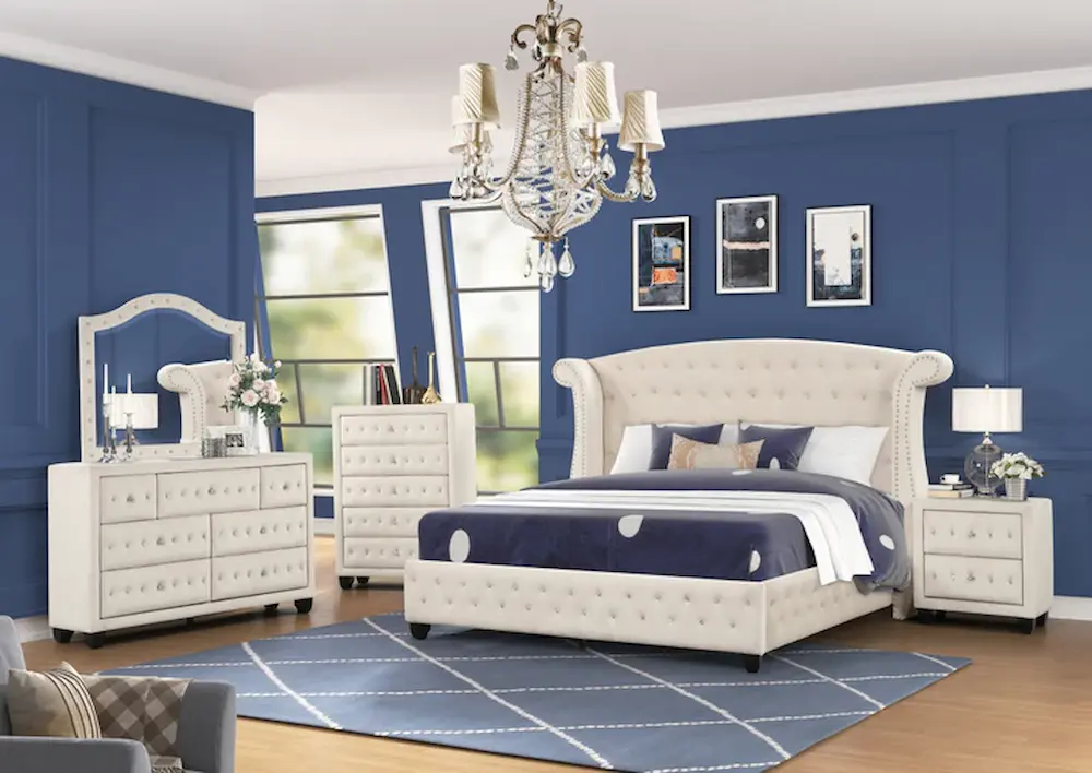 Elegant blue bedroom with white furniture set.