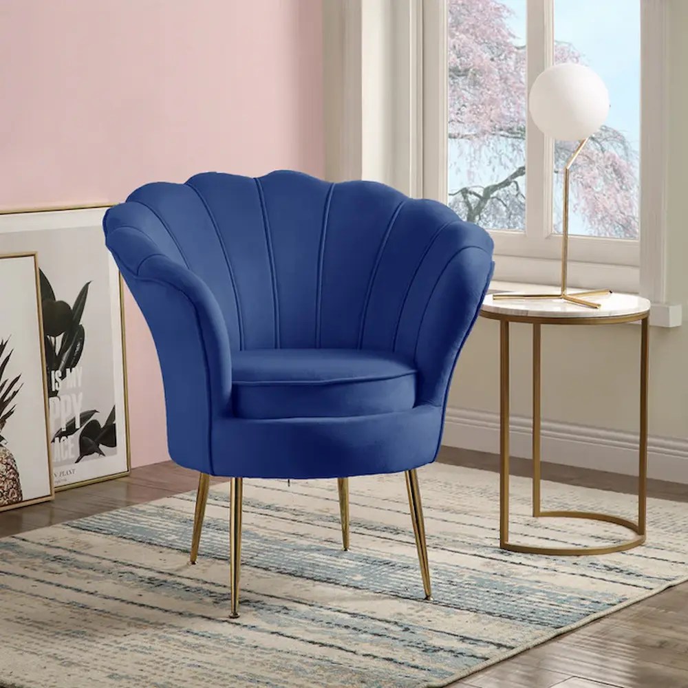 Blue velvet scalloped back accent chair with gold legs.