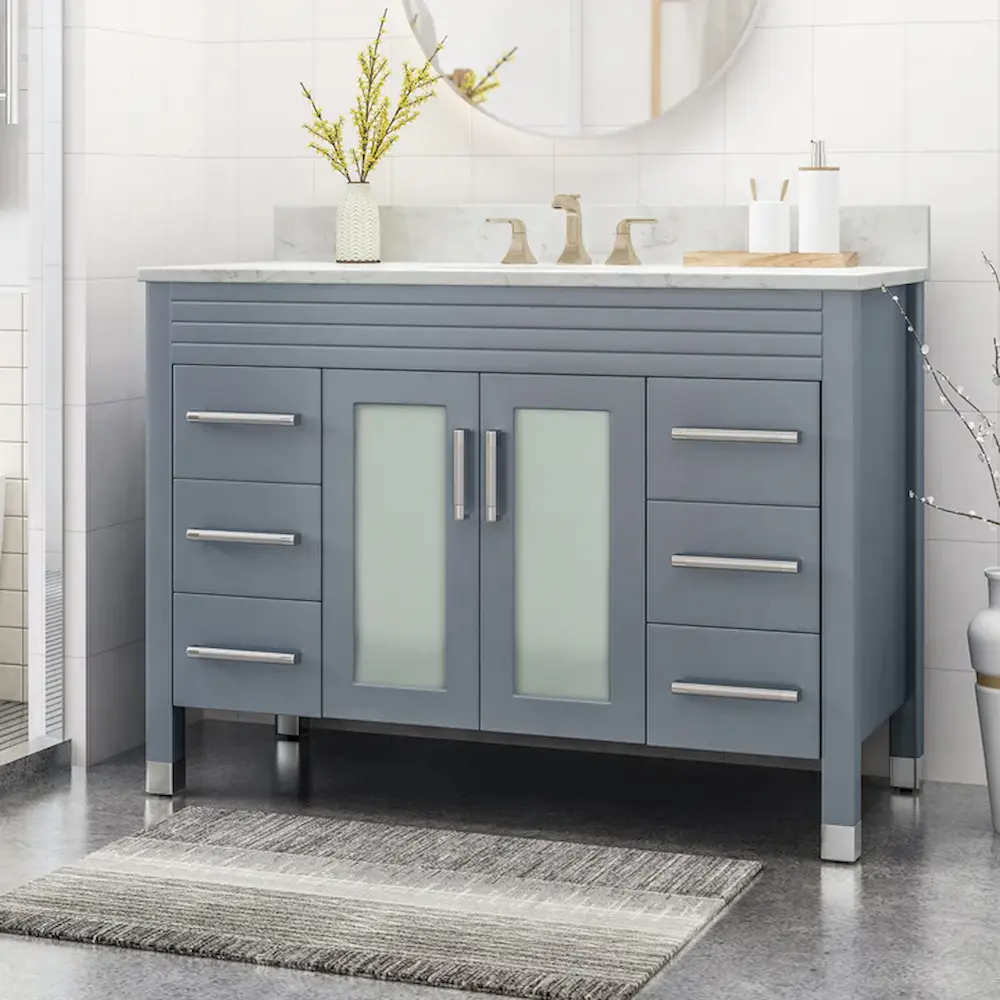 Modern gray bathroom vanity with sink and drawers.